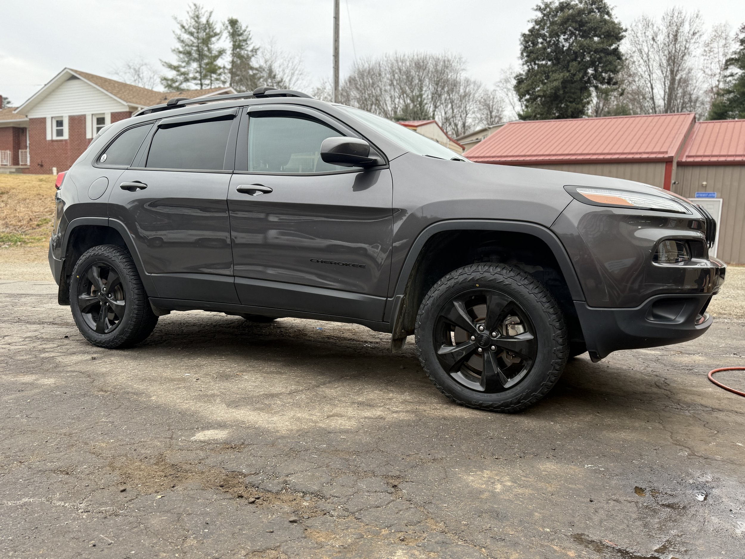 Jeep Cherokee on gloss black custom wheels