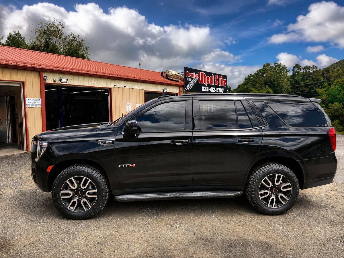 Black GMC Yukon AT4 on all-terrain tires in Western North Carolina