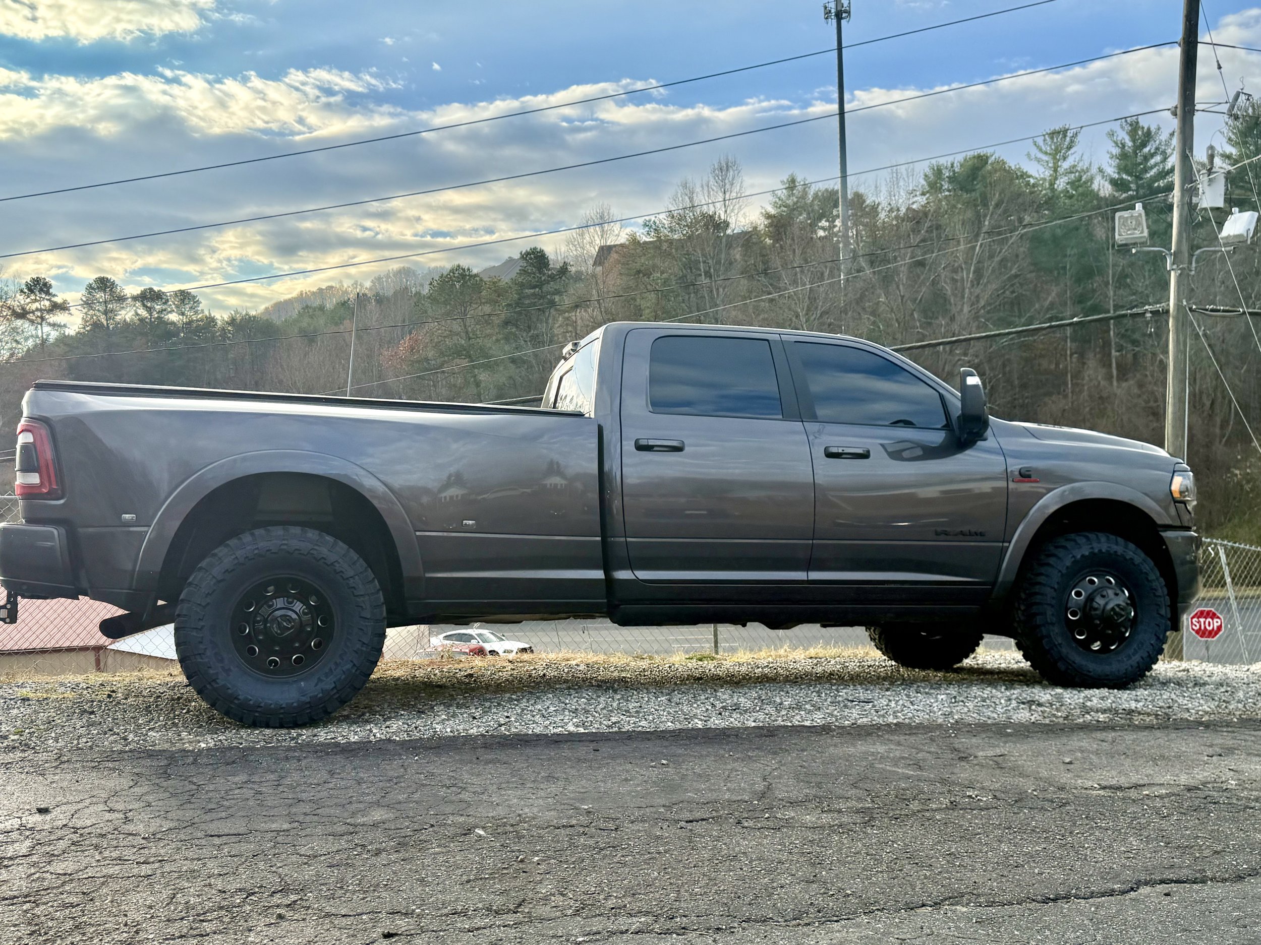 Ram 3500 dually on black wheels with mud-terrain tires